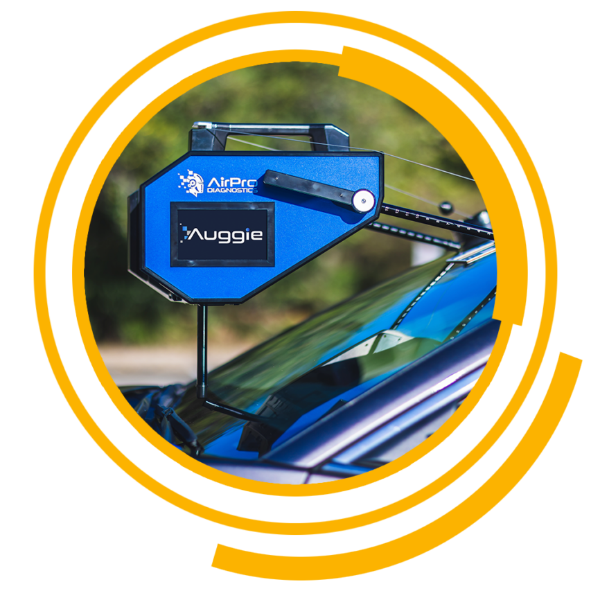 AirPro Diagnostics Auggie Tool on a vehicle windshield
